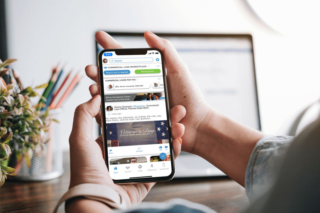 Banker Using the BANCreach App on Cellphone